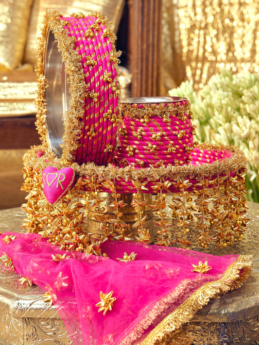Kumkum rani pink Karwa Chauth pooja hamper displayed as a coordinated handcrafted set