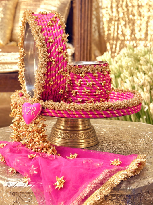 Kumkum rani pink Karwa Chauth pooja hamper displayed as a coordinated handcrafted set