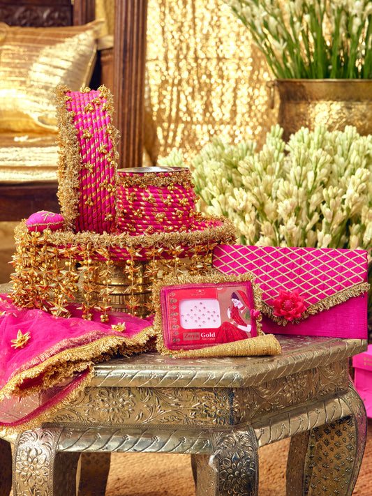Kumkum rani pink Karwa Chauth pooja hamper displayed as a coordinated handcrafted set