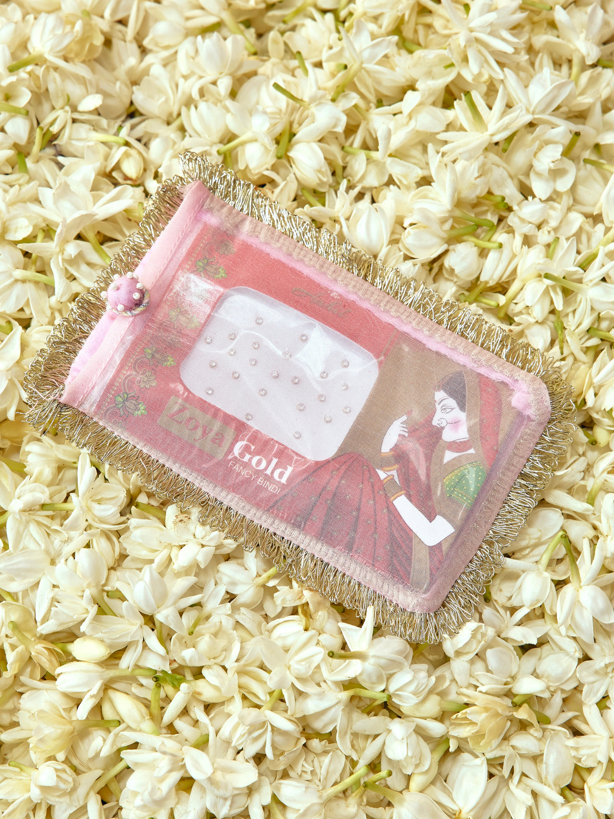 Chandini soft pastel bindi cover with light gold badla dori and pearl accents