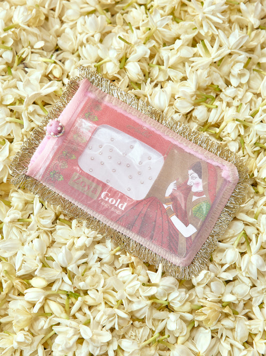 Chandini soft pastel bindi cover with light gold badla dori and pearl accents