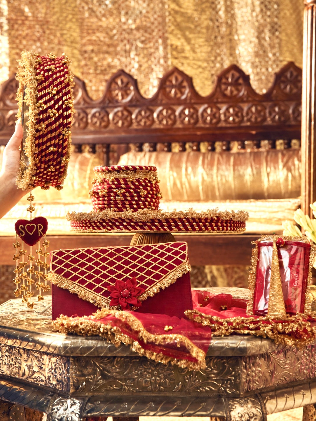 Kumkum maroon Karwa Chauth pooja hamper displayed as a coordinated handcrafted set