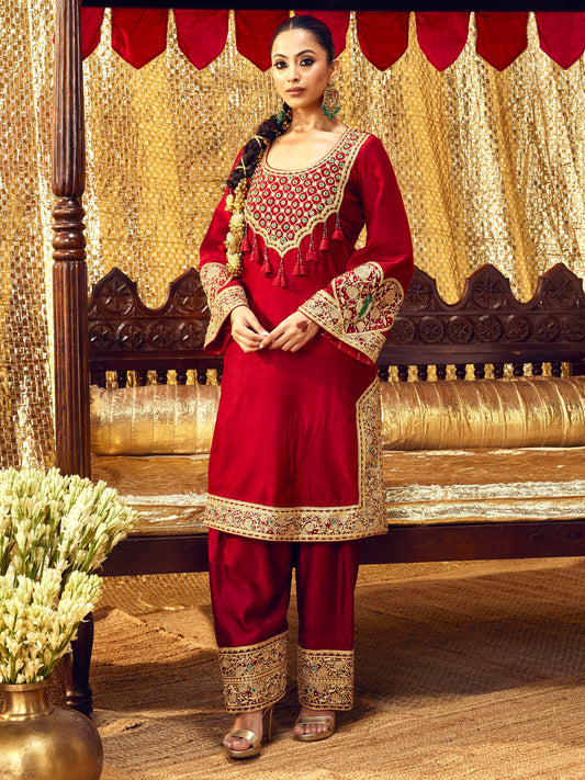 Model wearing the Tota Maina maroon farshi salwar set with handcrafted festive embroidery