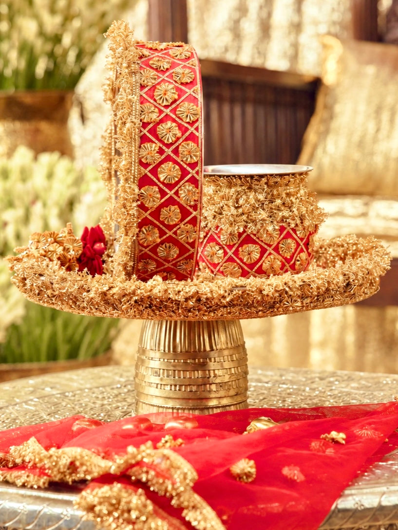 Chamak red Karwa Chauth pooja hamper displayed as a coordinated handcrafted set
