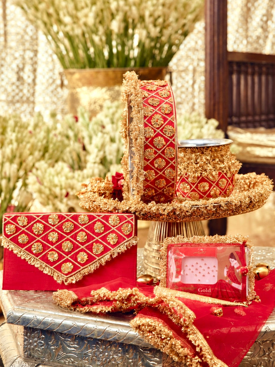 Chamak red Karwa Chauth pooja hamper displayed as a coordinated handcrafted set