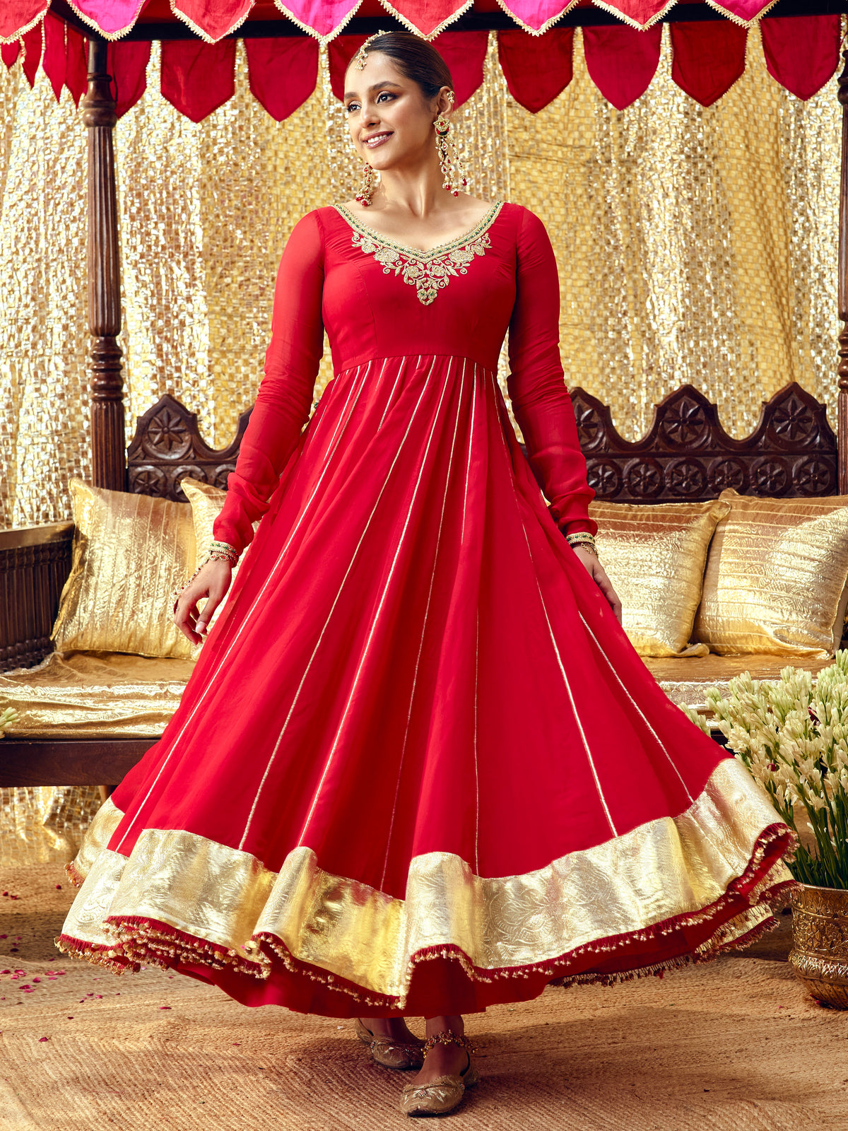 Model wearing the Gulaab red anarkali set with handcrafted festive embroidery