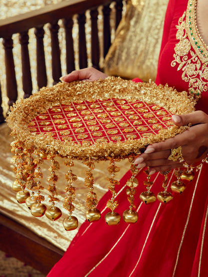 Chamak red Karwa Chauth thal with intricate gota work and festive gold accents