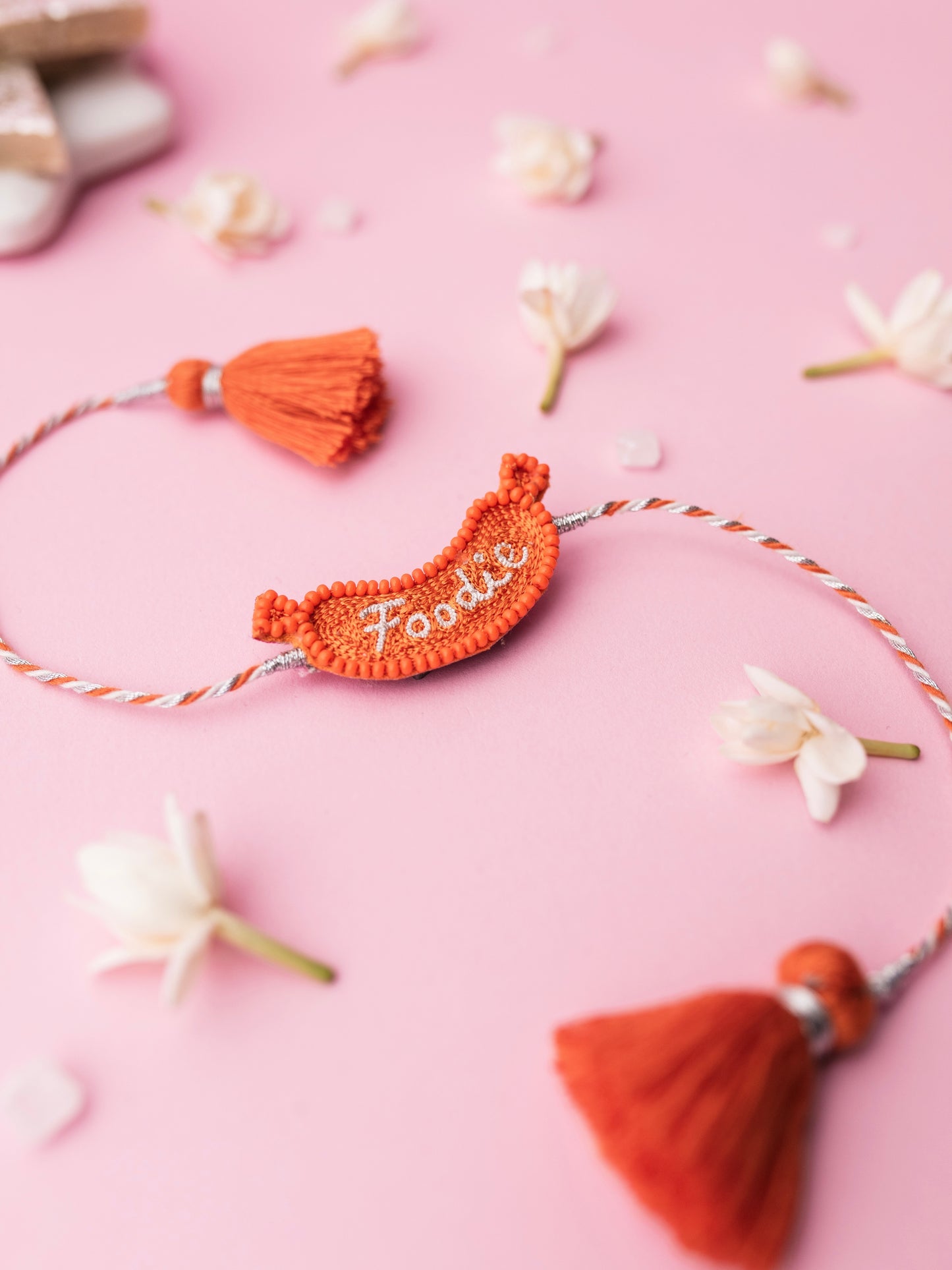 Decorative pet rakhi with foodie text