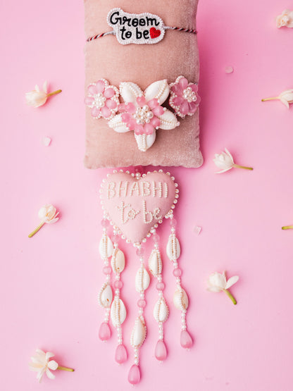 Decorative groom to be rakhi and bhabhi to be lumba with floral details and 
