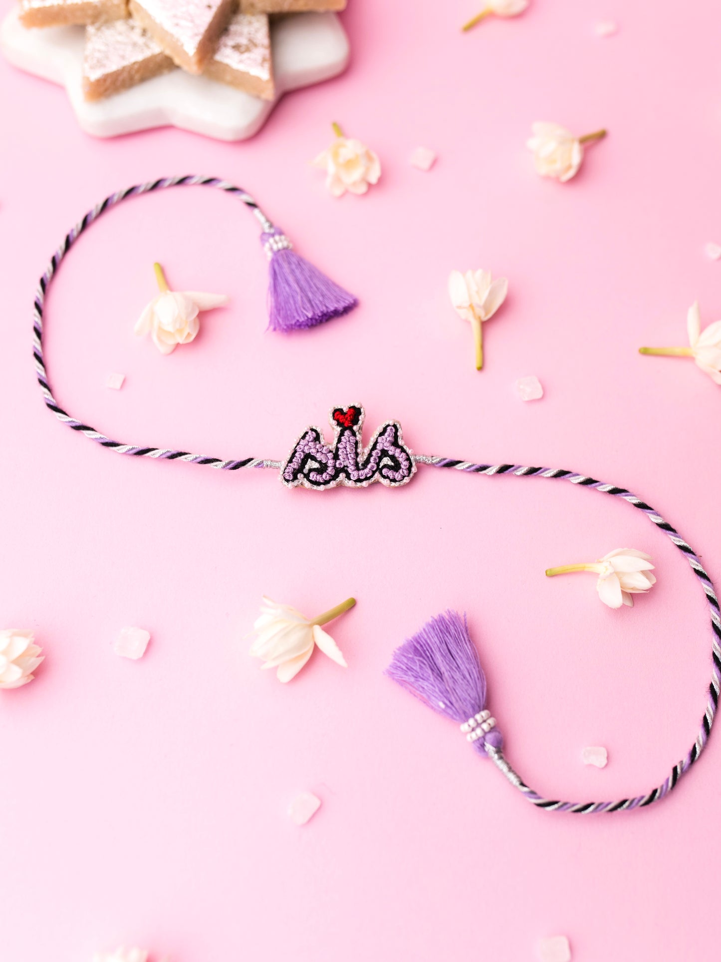 Decorative sister rakhi with  sis text