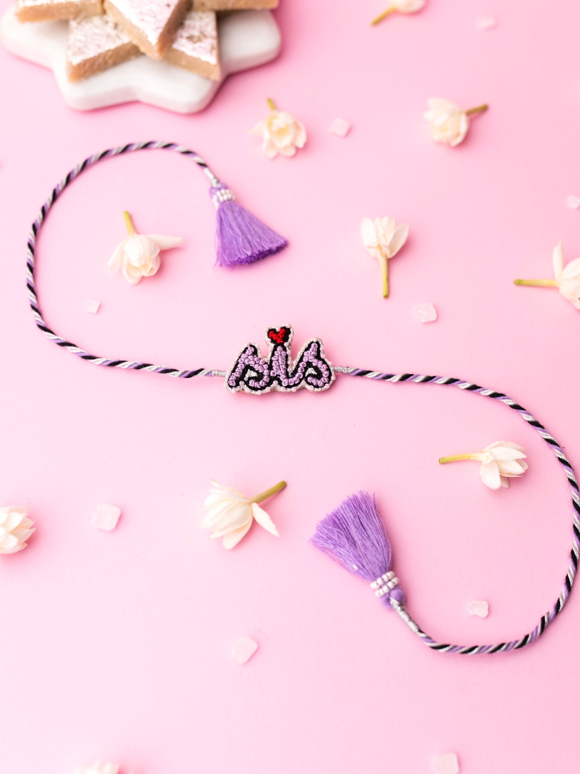 Decorative sister rakhi with  sis text